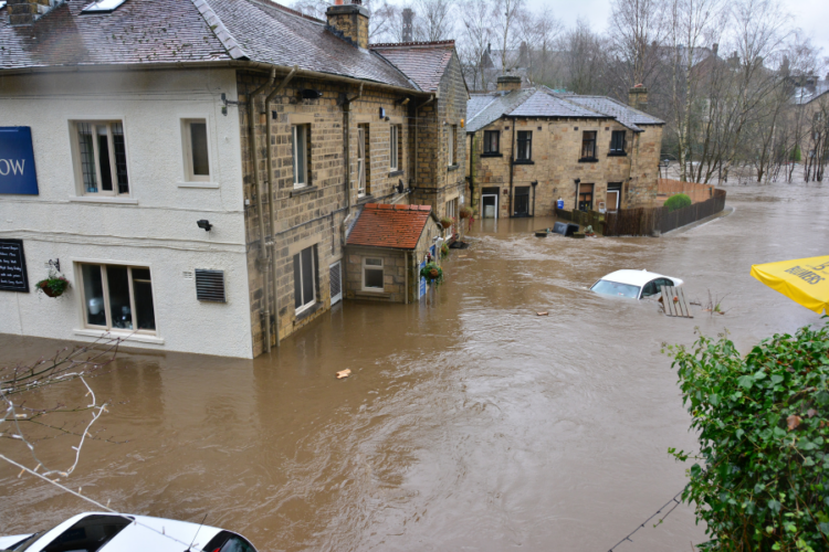 Flood causing damage to homes and buildings